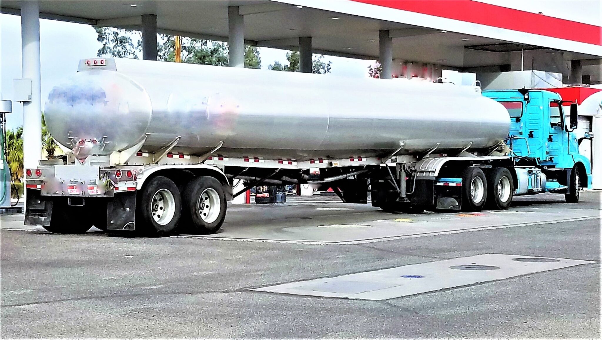 gas-and-oil-tanker-truck-refueling-the-gas-statio-2022-11-08-05-51-36-utc